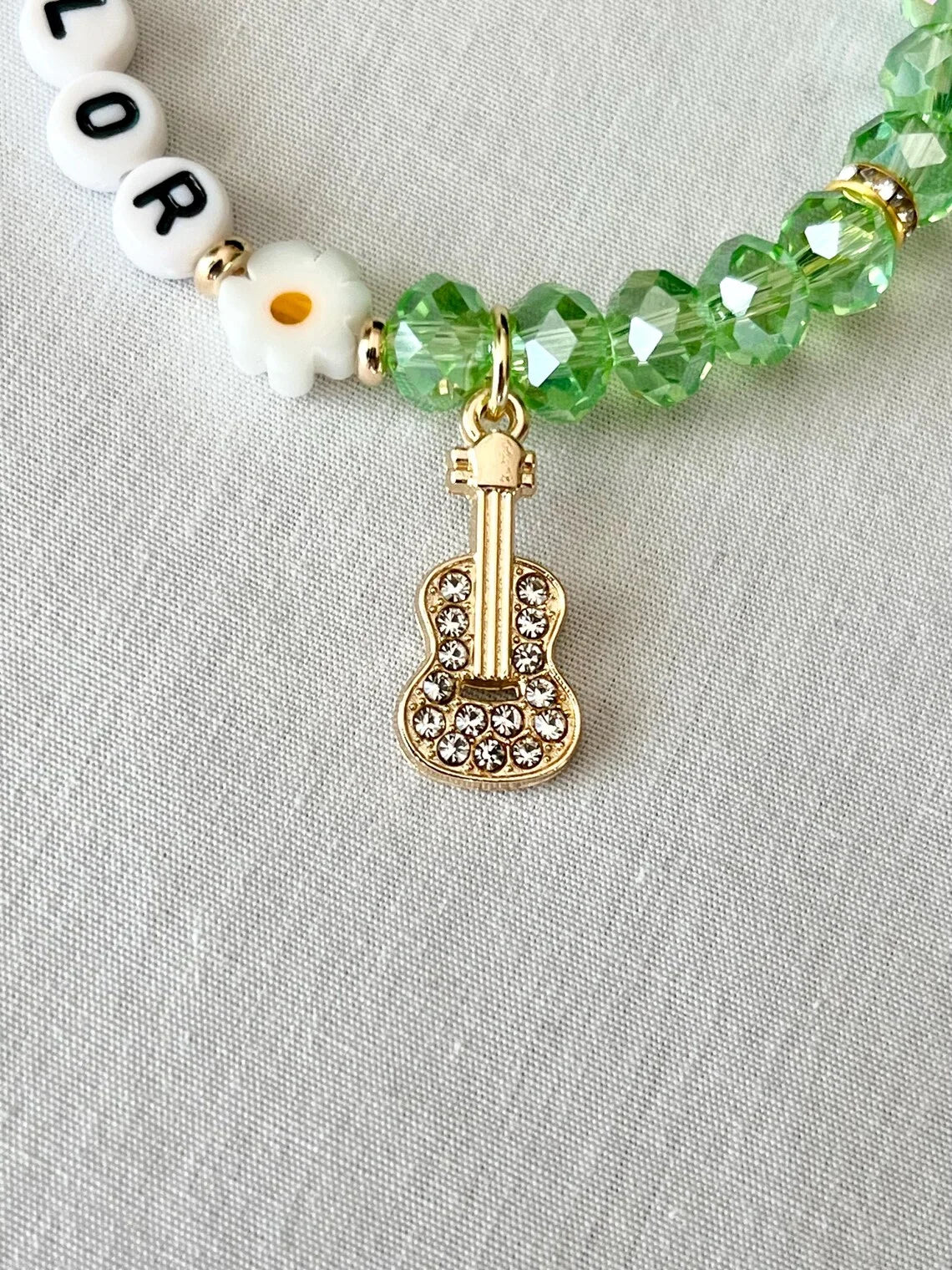 Debut-Era Inspired Friendship Bracelet – Green Crystal Beads & Guitar Charm | Aesthetic Fan Gift - élise & madelyn